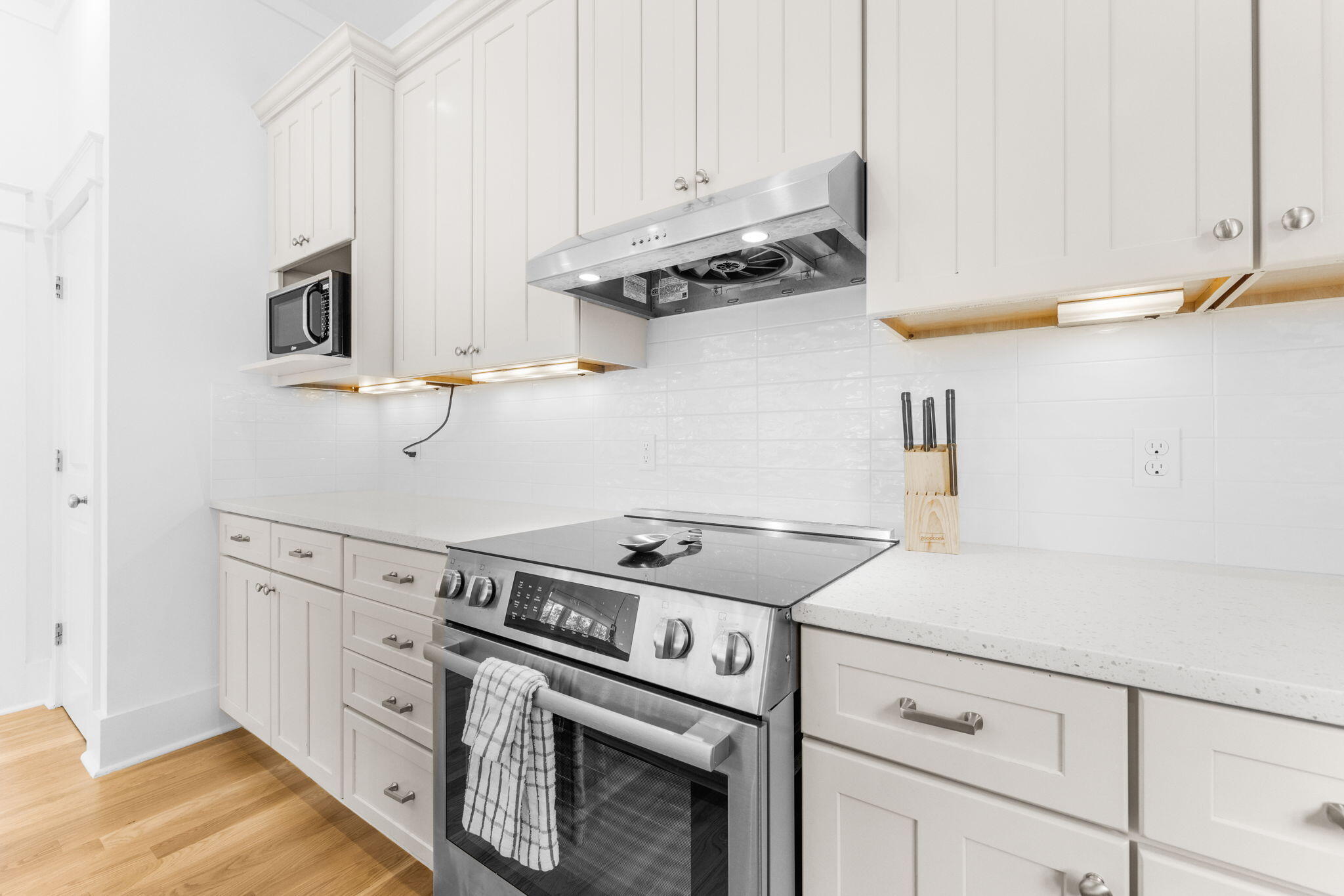 30 Chelsea Loop Road Santa Rosa Beach, FL 32459 - Photo 8 of 67 a kitchen with stainless steel appliances granite countertop white cabinets and a stove