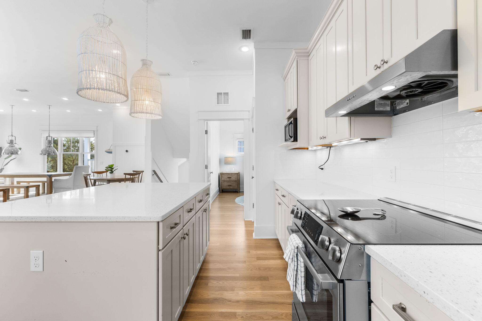 30 Chelsea Loop Road Santa Rosa Beach, FL 32459 - Photo 9 of 67 a kitchen with kitchen island a stove a sink and a refrigerator