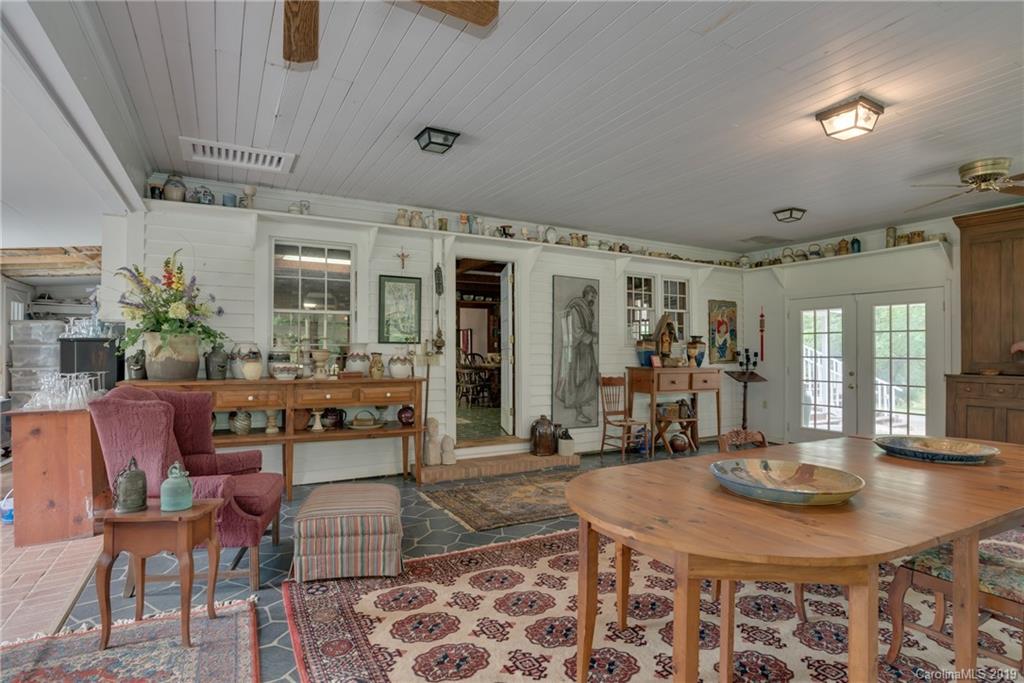 1264 Maple Creek Road Rutherfordton, NC 28139 - Photo 3 of 34 a room with lots of table chair and wooden floor