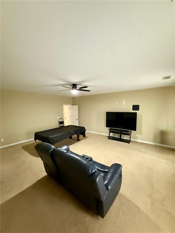 1530 Stewart Ridge Drive Buford, GA 30518 - Photo 11 of 26 a living room with couches and a flat screen tv