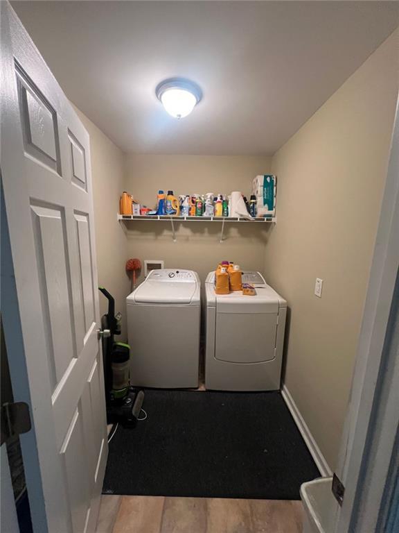 1530 Stewart Ridge Drive Buford, GA 30518 - Photo 13 of 26 a utility room with dryer and washer