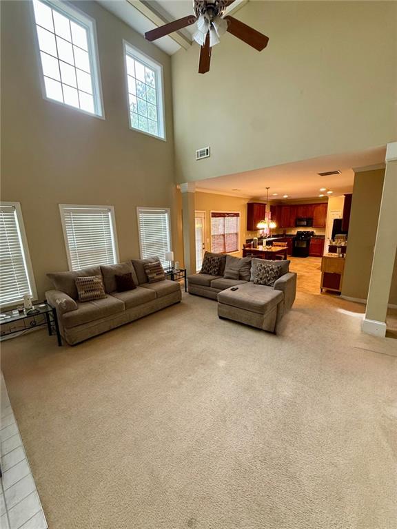 1530 Stewart Ridge Drive Buford, GA 30518 - Photo 7 of 26 a living room with furniture and a flat screen tv