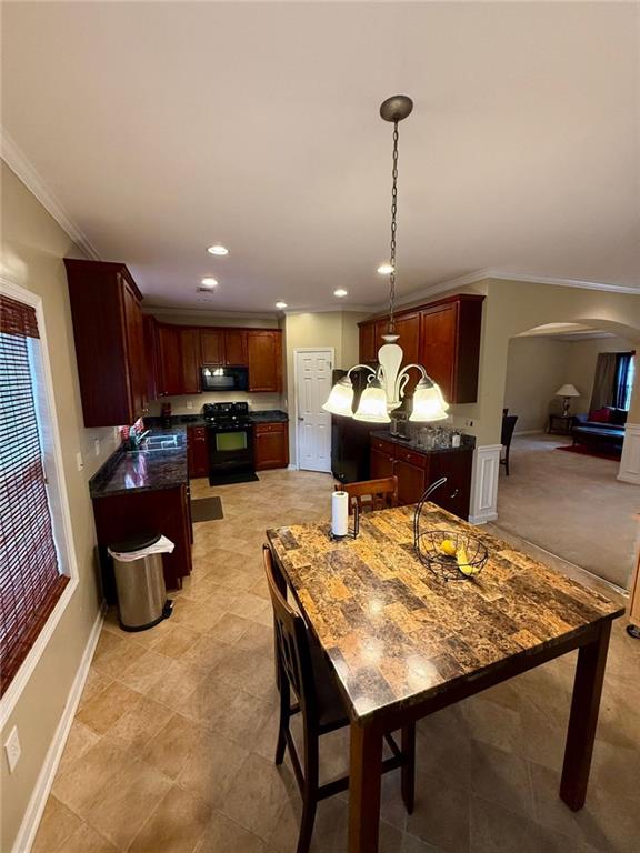 1530 Stewart Ridge Drive Buford, GA 30518 - Photo 9 of 26 a kitchen with a table and chairs