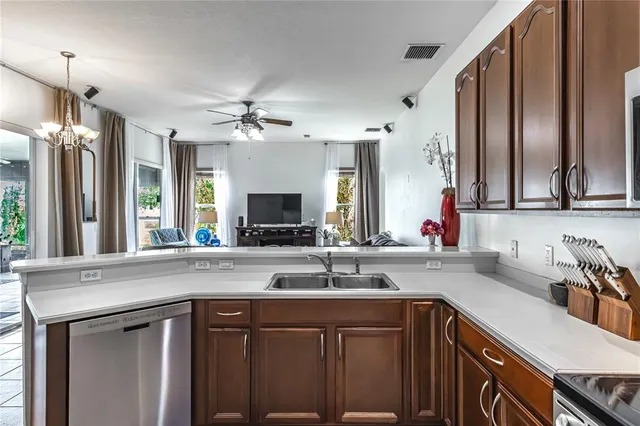 a kitchen with a sink stove and microwave