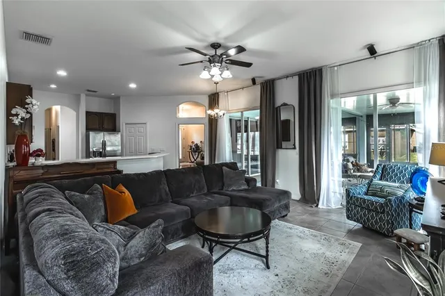 a living room with furniture and a large window