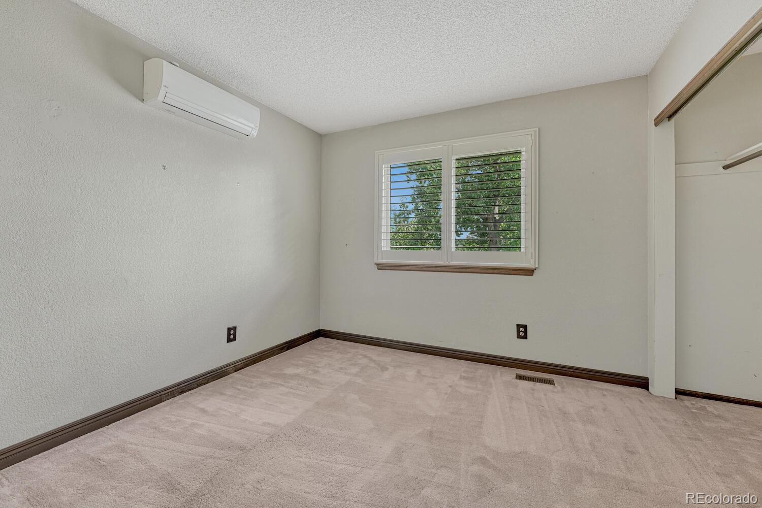 302 Northridge Road Highlands Ranch, CO 80126 - Photo 15 of 36 a view of an empty room with a window