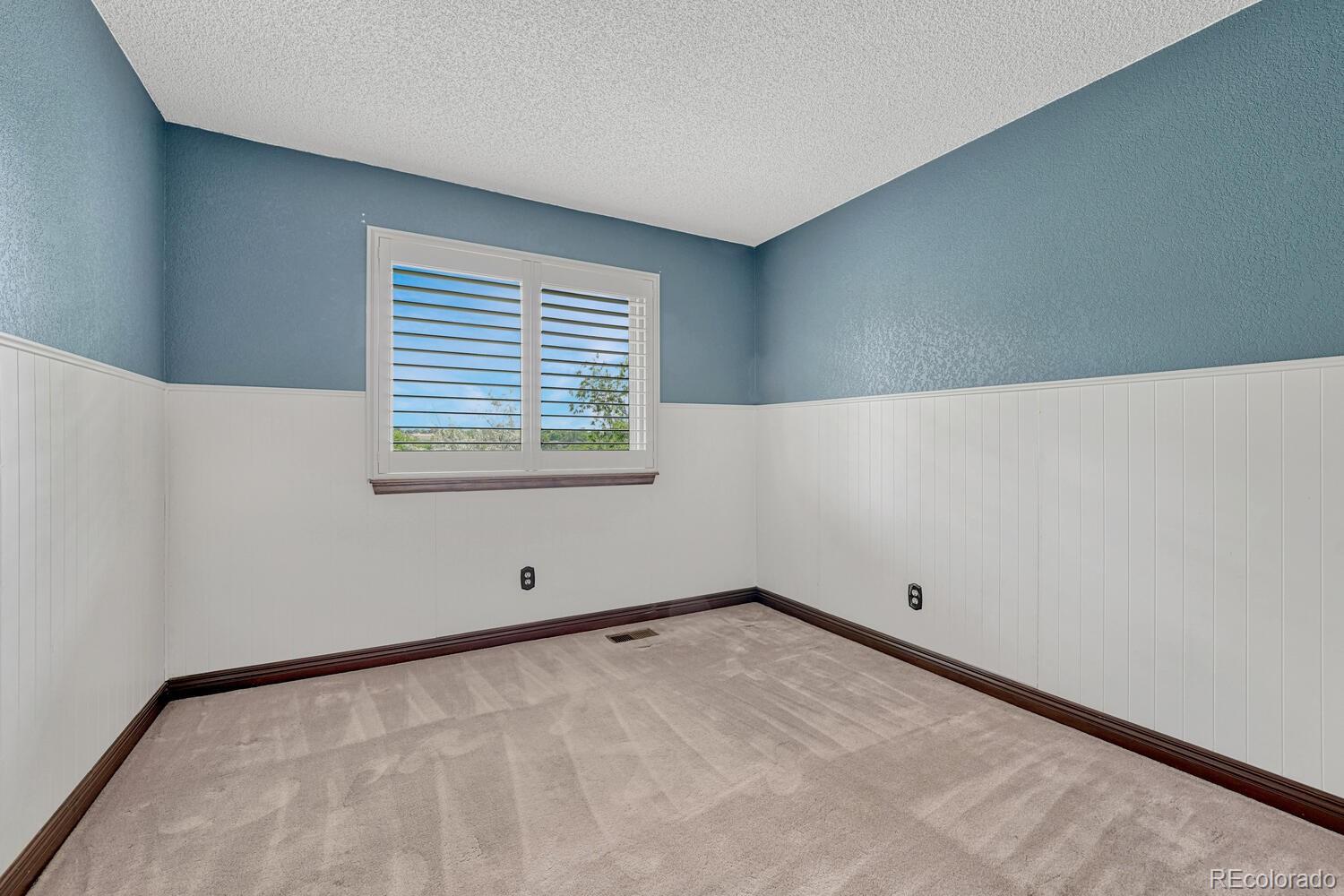 302 Northridge Road Highlands Ranch, CO 80126 - Photo 16 of 36 a view of an empty room with a window