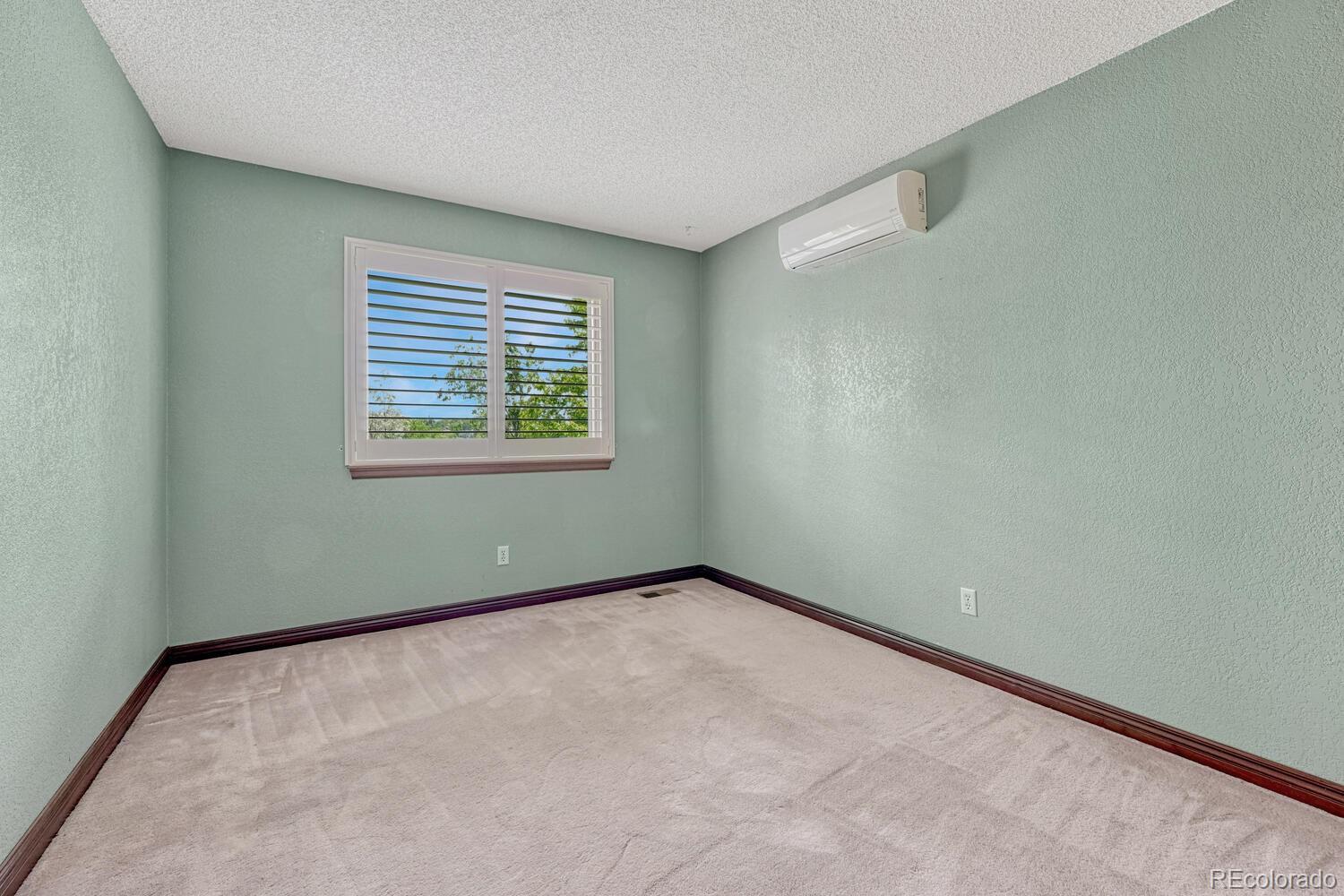302 Northridge Road Highlands Ranch, CO 80126 - Photo 18 of 36 an empty room with a window