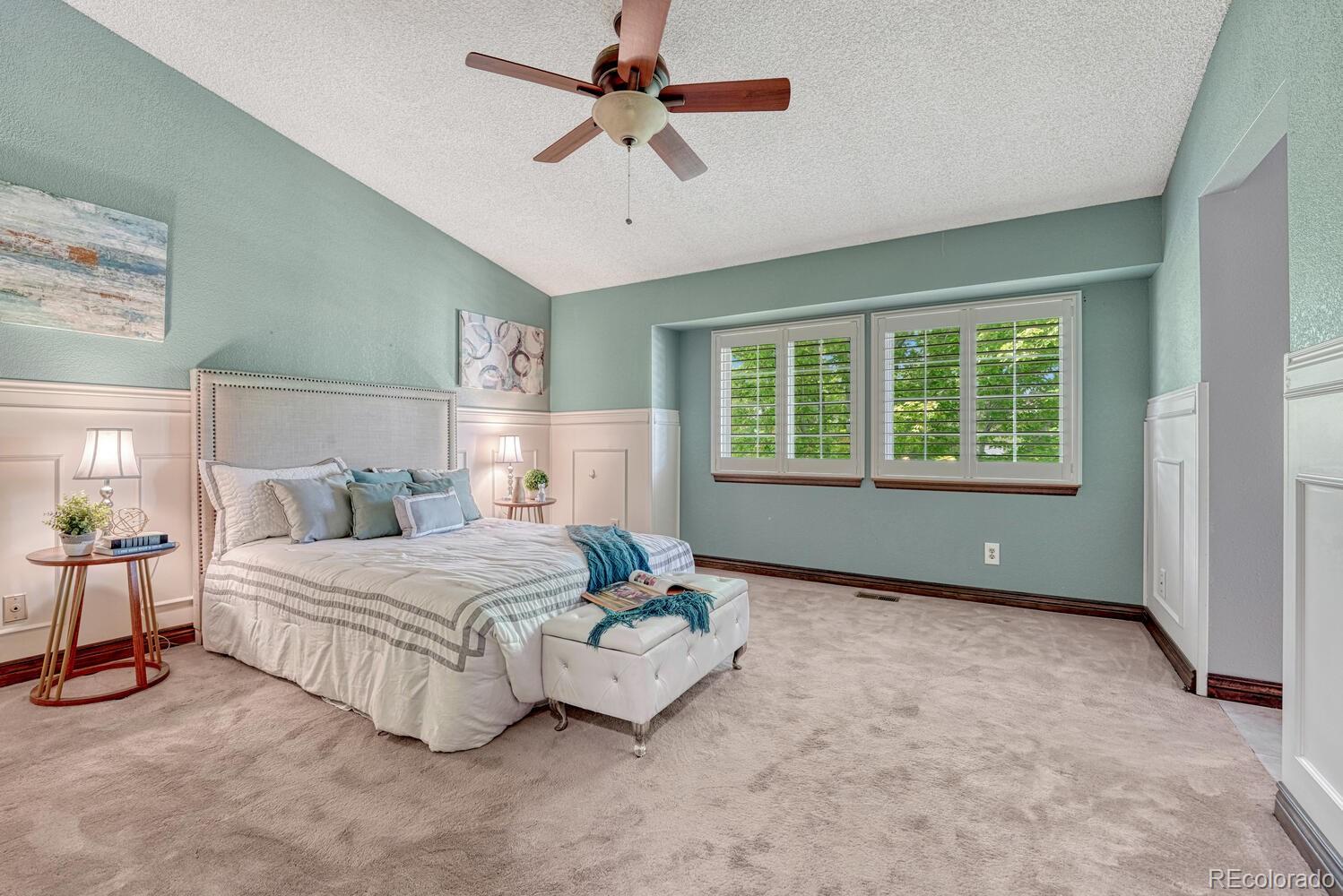 302 Northridge Road Highlands Ranch, CO 80126 - Photo 19 of 36 a bedroom with a bed chandelier and a window