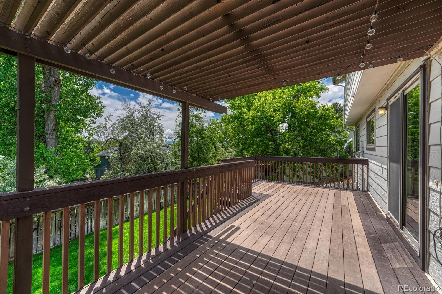 302 Northridge Road Highlands Ranch, CO 80126 - Photo 26 of 36 a balcony with wooden floor in outdoor space