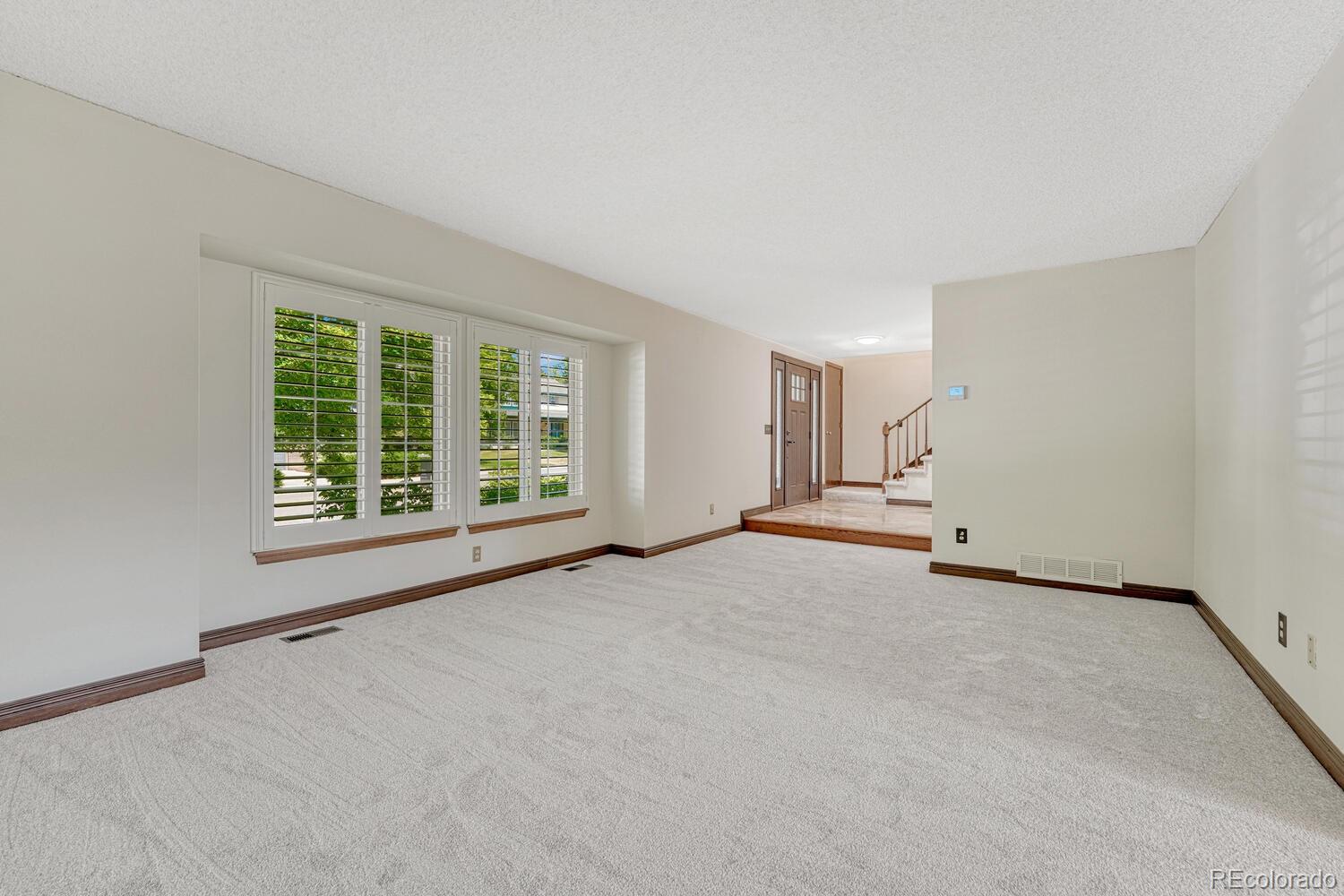 302 Northridge Road Highlands Ranch, CO 80126 - Photo 7 of 36 a view of an empty room with a window