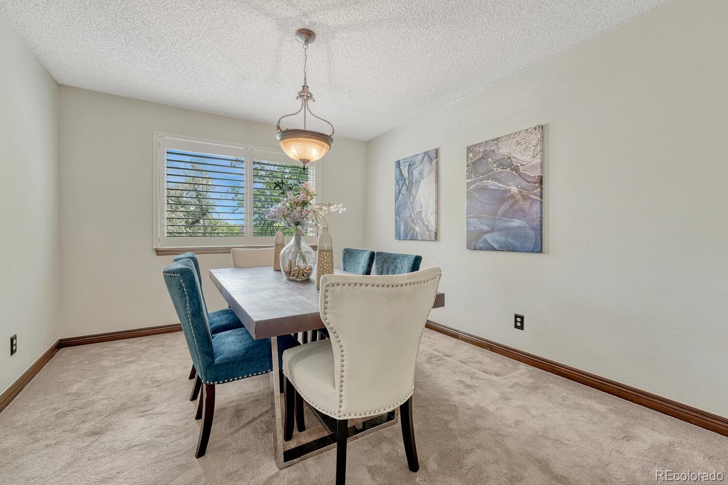 302 Northridge Road Highlands Ranch, CO 80126 - Photo 9 of 36 a view of a dining room with furniture window and wooden floor