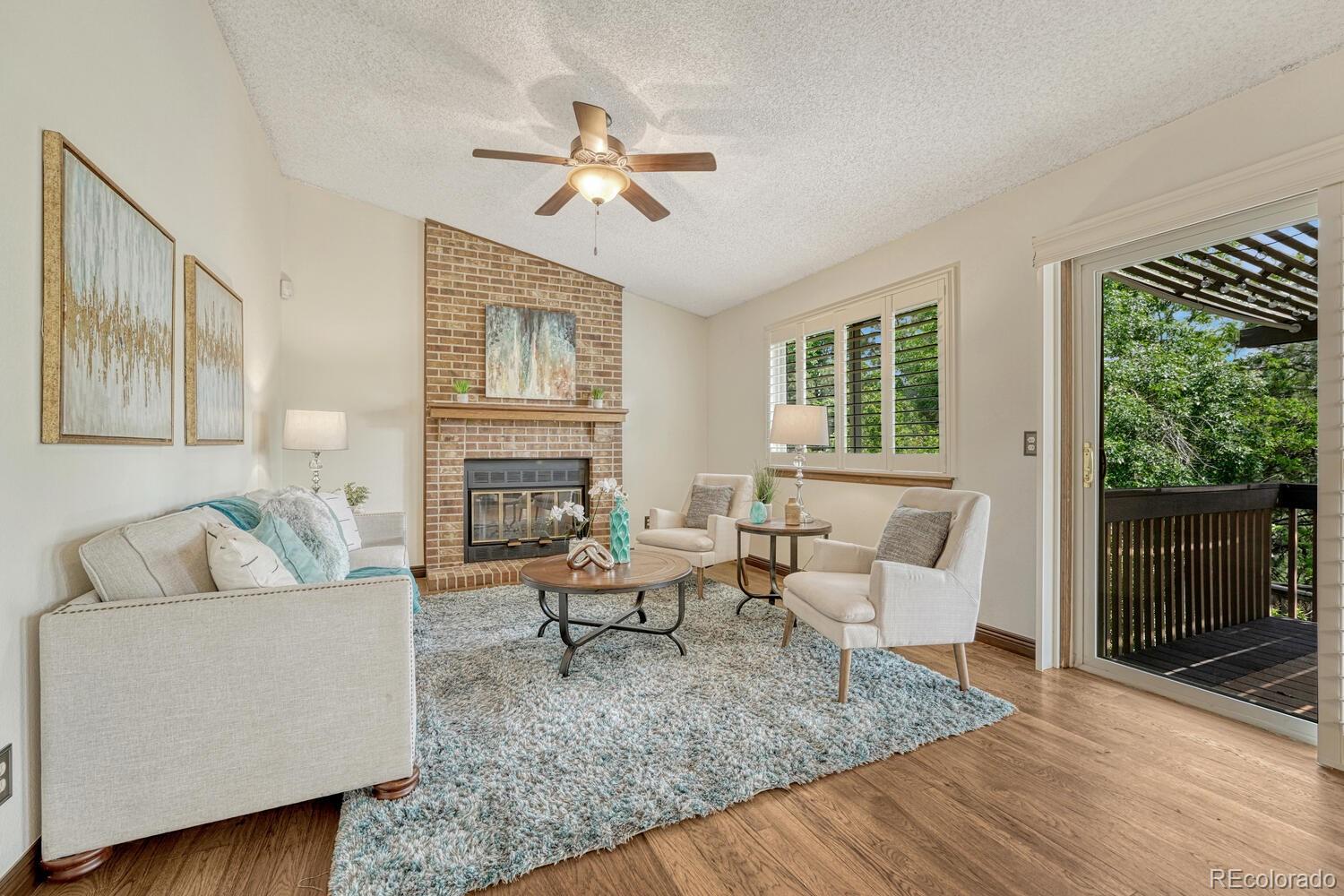 302 Northridge Road Highlands Ranch, CO 80126 - Photo 10 of 36 a living room with furniture and a large window