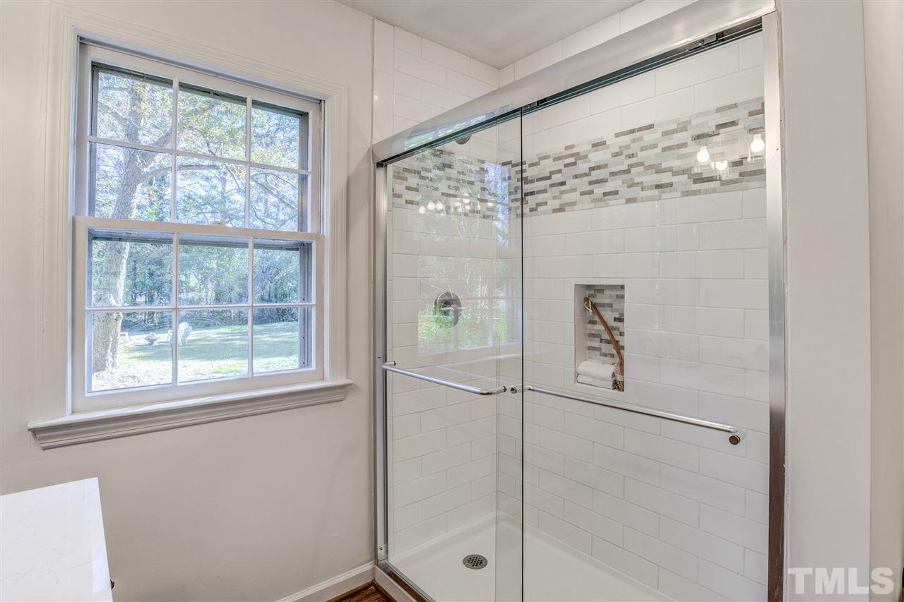 3915 Randell Road Garner, NC 27529 - Photo 14 of 24 a bathroom with a large window