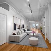 a living room with furniture and a table
