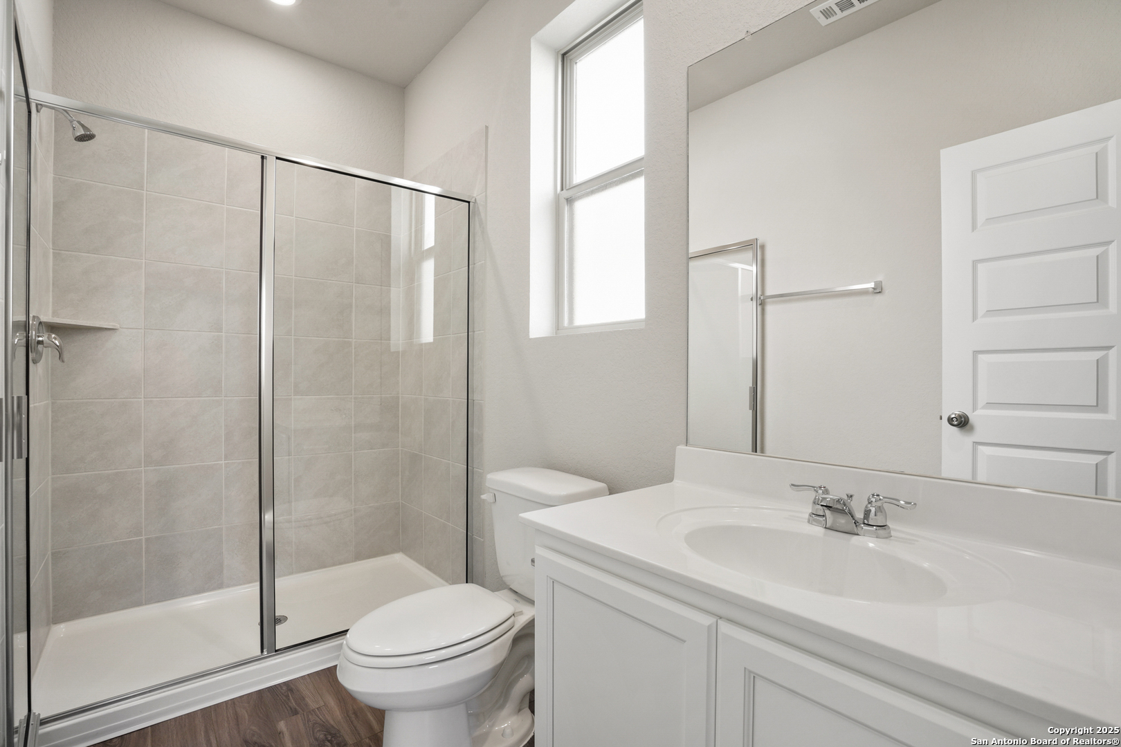 4946 Blue Ranch San Antonio, TX 78222 - Photo 12 of 32 a bathroom with a sink a toilet and shower