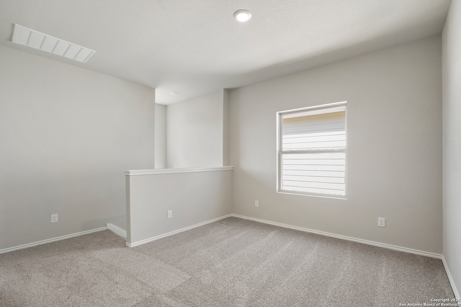 4946 Blue Ranch San Antonio, TX 78222 - Photo 13 of 32 an empty room with a window