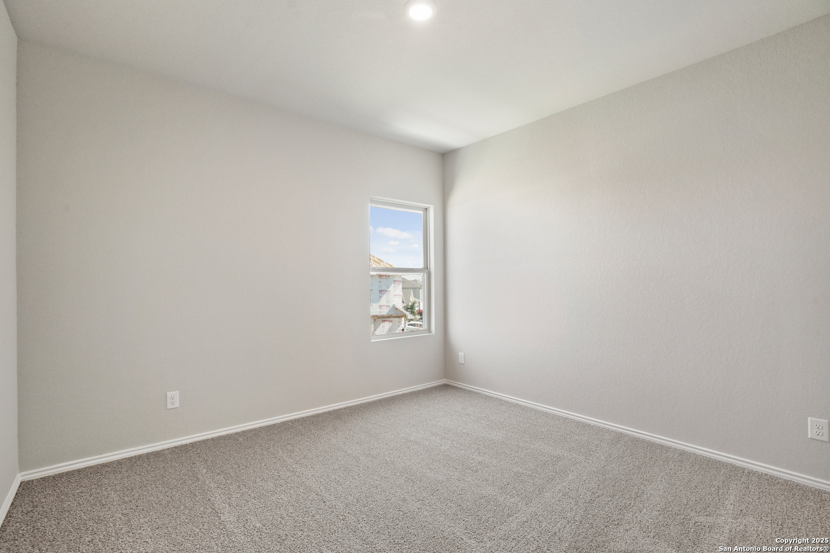 4946 Blue Ranch San Antonio, TX 78222 - Photo 17 of 32 a view of an empty room and window