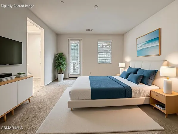 a bedroom with a bed and a flat screen television