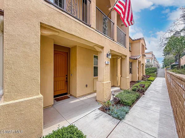 a view of a brick building with many windows