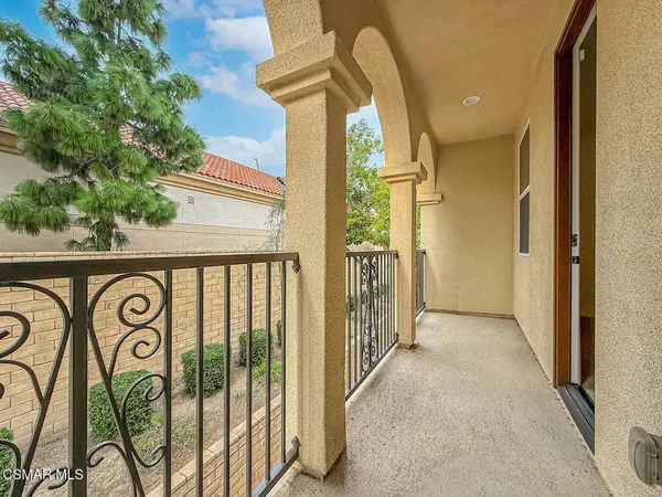 a view of a door and a street view