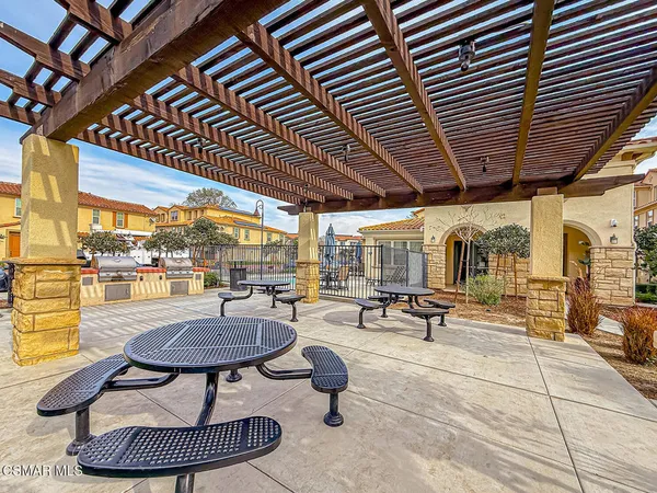 a view of a balcony with an outdoor seating