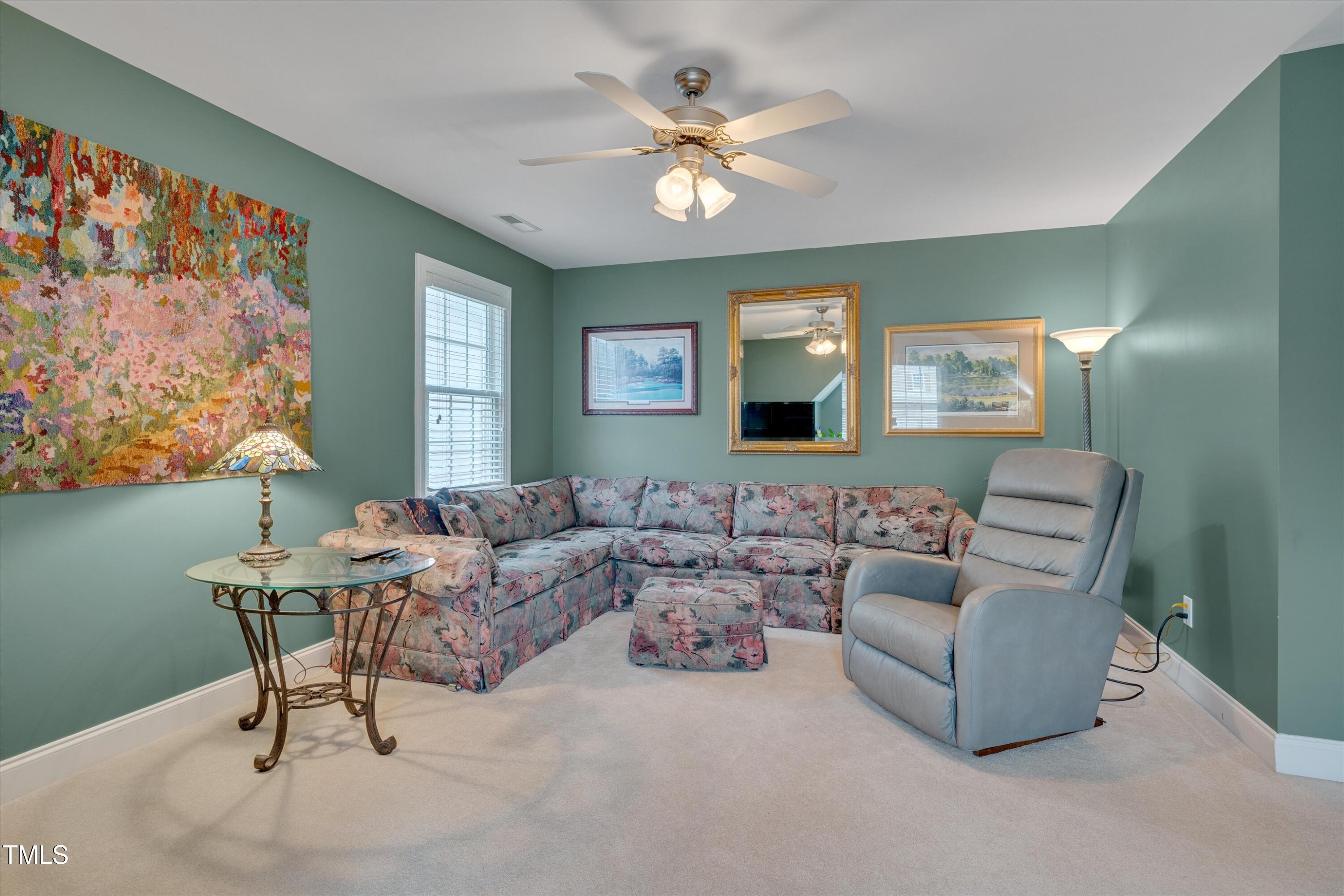 8308 Cazavini Court Raleigh, NC 27613 - Photo 36 of 46 a living room with furniture and a large window