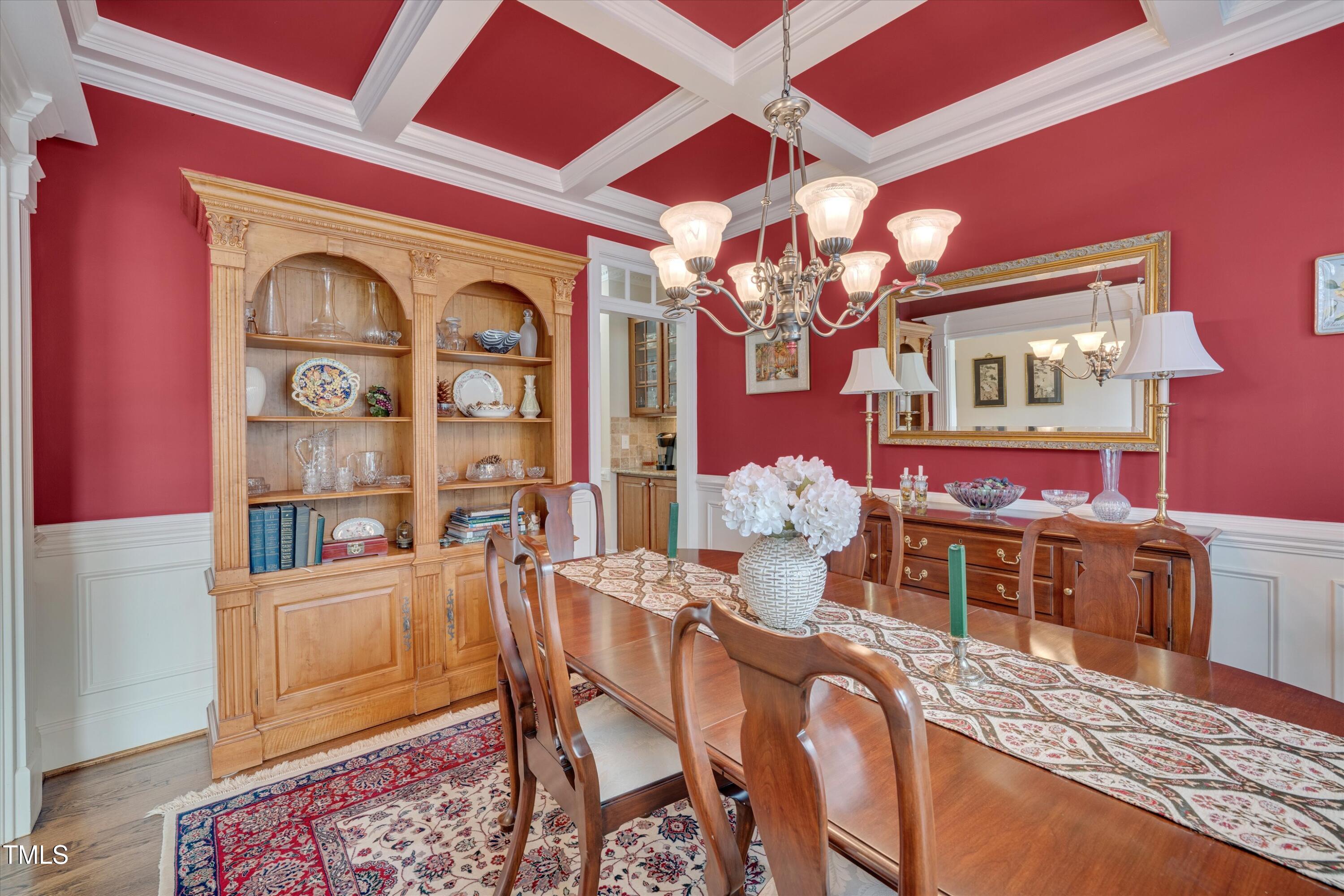8308 Cazavini Court Raleigh, NC 27613 - Photo 6 of 46 a view of a dining room with furniture and chandelier