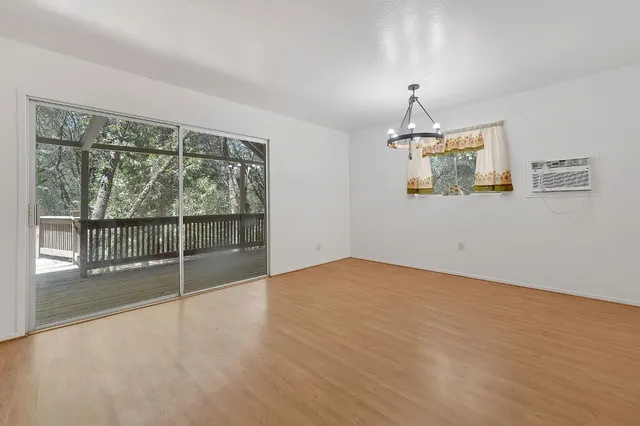 a spacious bathroom with a granite countertop sink a mirror and a