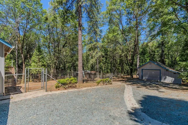 an aerial view of a house with outdoor space