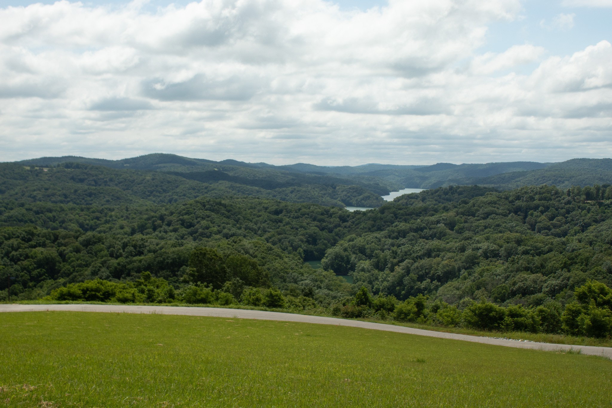 73 B Swan Ridge Road Celina, TN 38551 - Photo 30 of 34 a view of a green field with mountains in the background