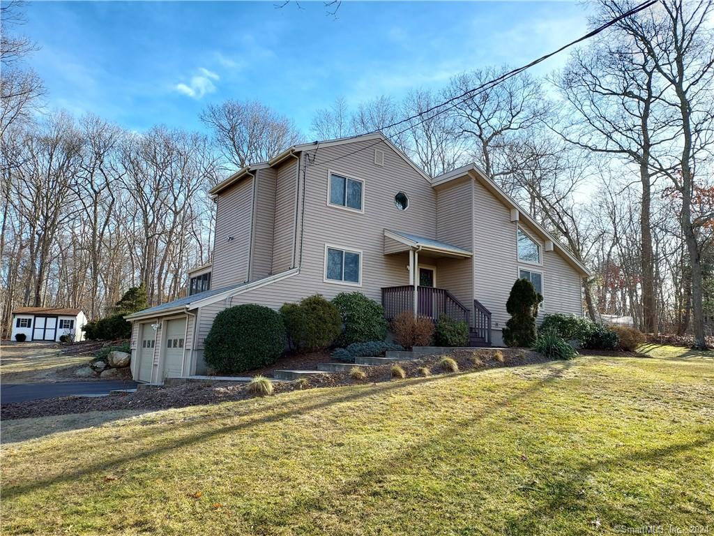 a view of a house with snow on the side of it