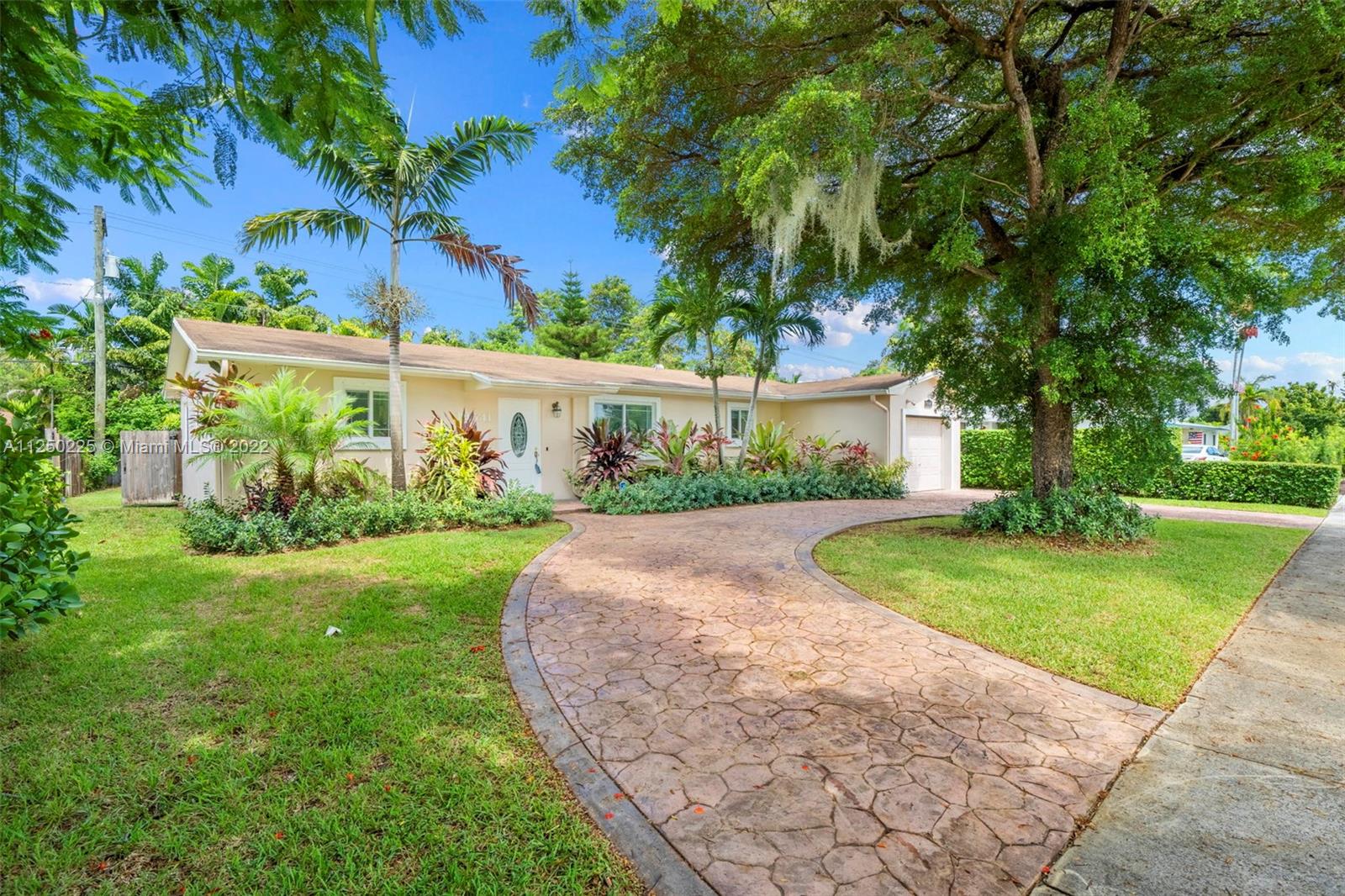 19541 Franjo Road Cutler Bay, FL 33157 - Photo 2 of 28 a front view of a house with garden