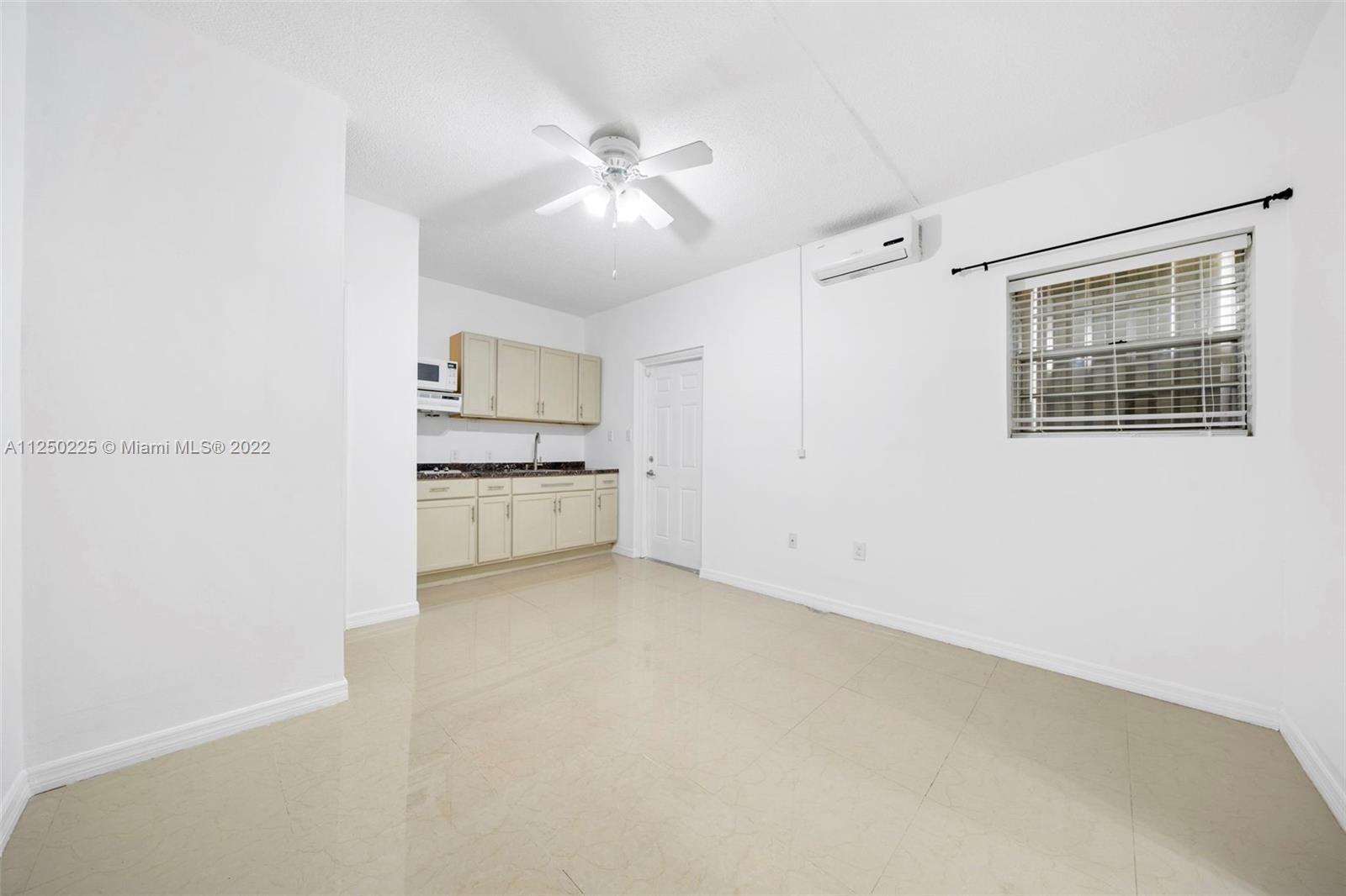 19541 Franjo Road Cutler Bay, FL 33157 - Photo 24 of 28 a view of a kitchen with an empty space and a window