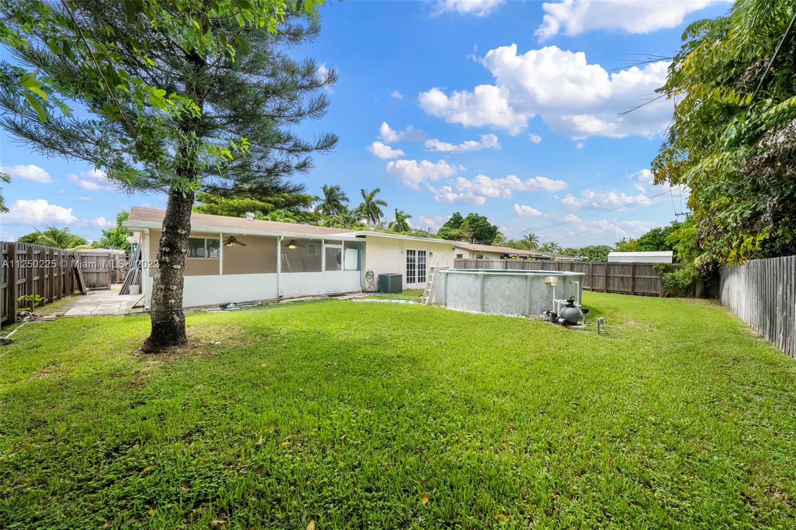 19541 Franjo Road Cutler Bay, FL 33157 - Photo 26 of 28 a view of a house with a backyard