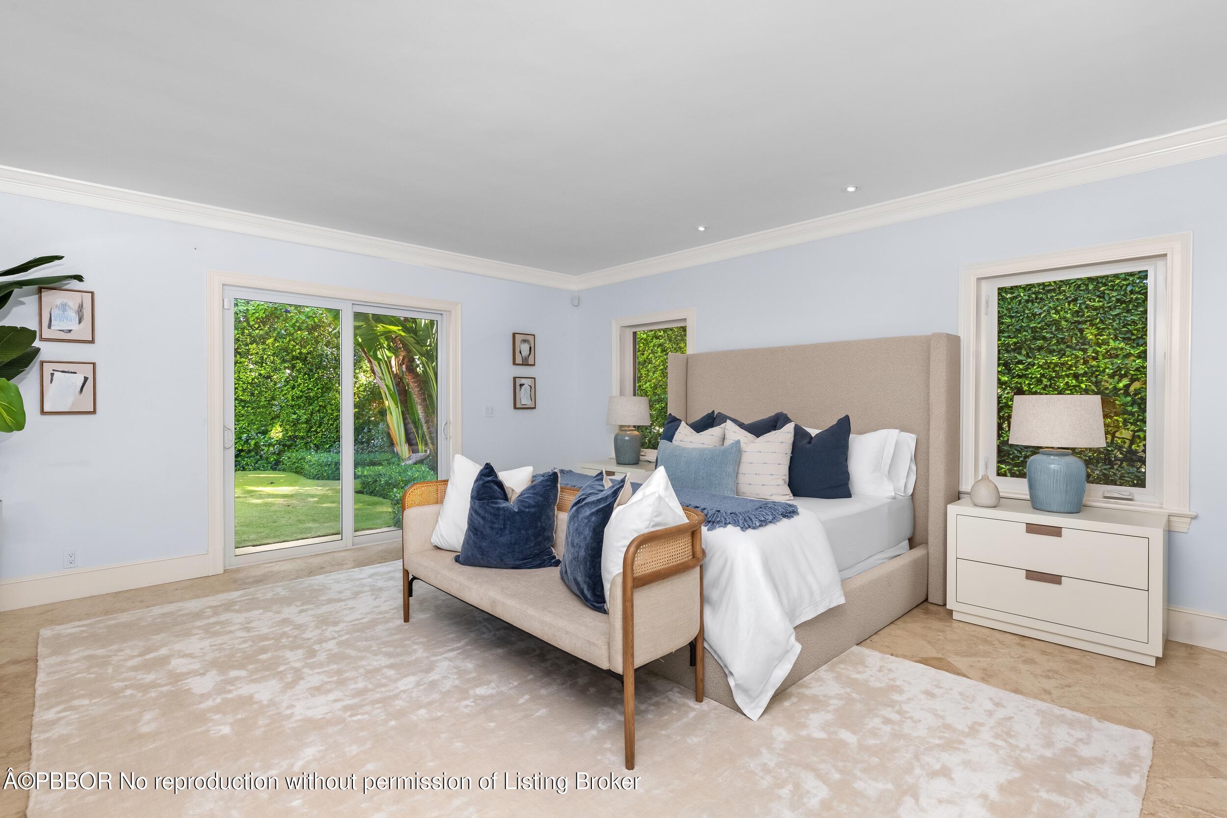 273 List Road Palm Beach, FL 33480 - Photo 12 of 54 a spacious bedroom with a bed and a couch