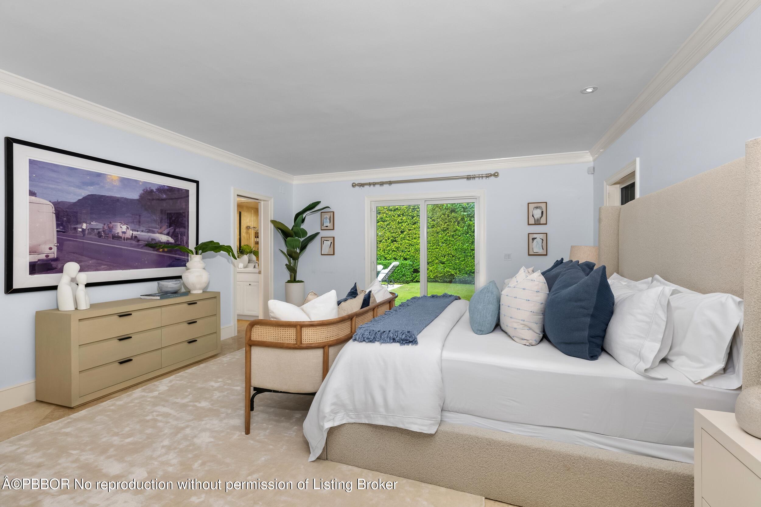 273 List Road Palm Beach, FL 33480 - Photo 13 of 54 a bedroom with a bed and large windows