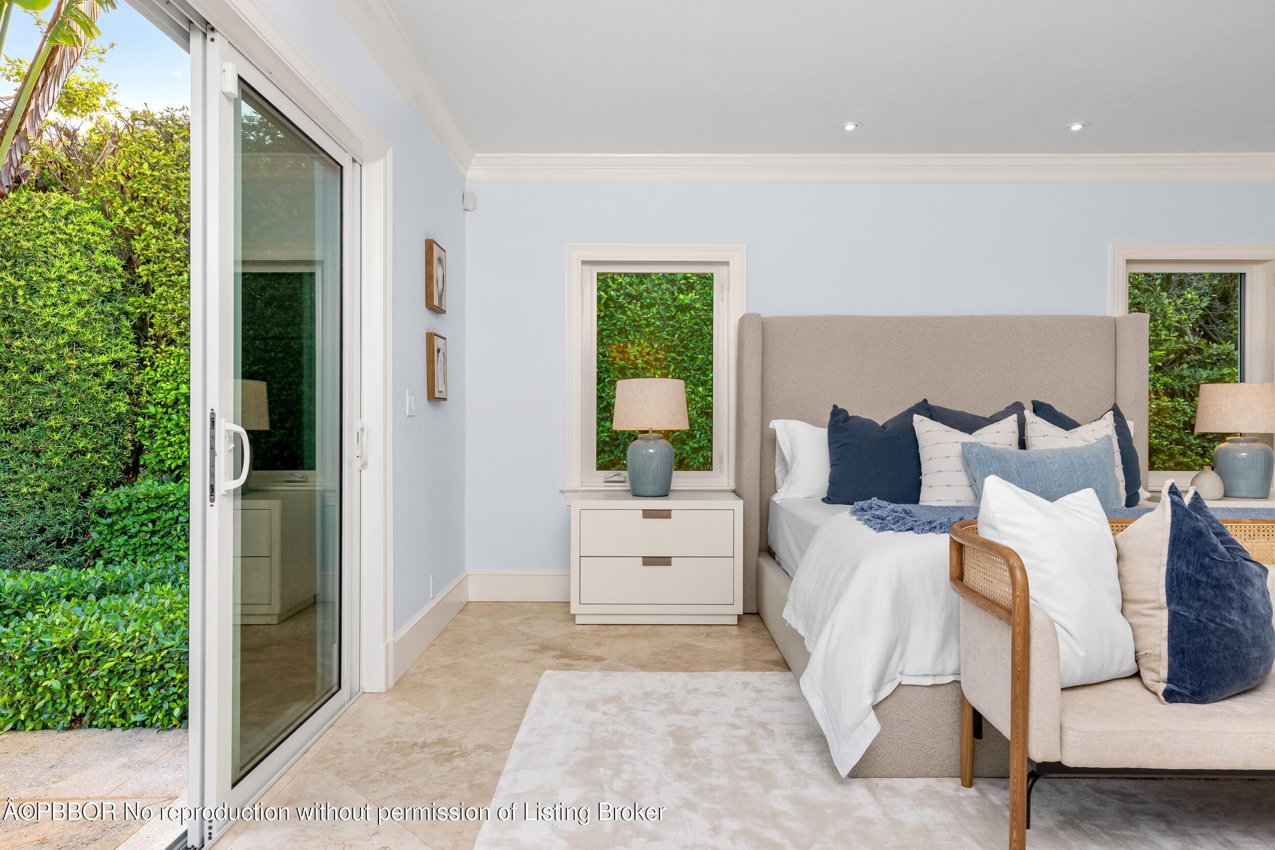 273 List Road Palm Beach, FL 33480 - Photo 14 of 54 a room with a bed and a large window