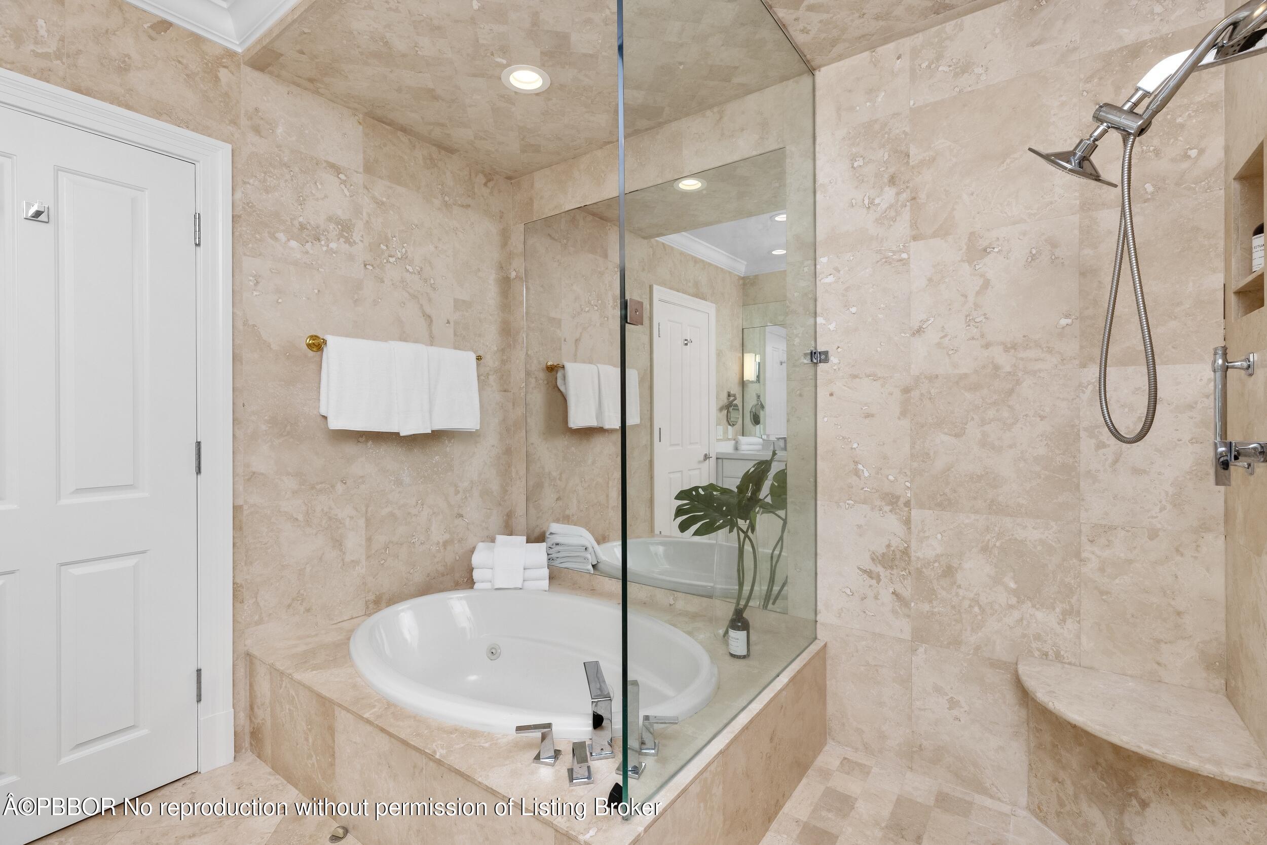 273 List Road Palm Beach, FL 33480 - Photo 16 of 54 a bathroom with a bathtub and shower