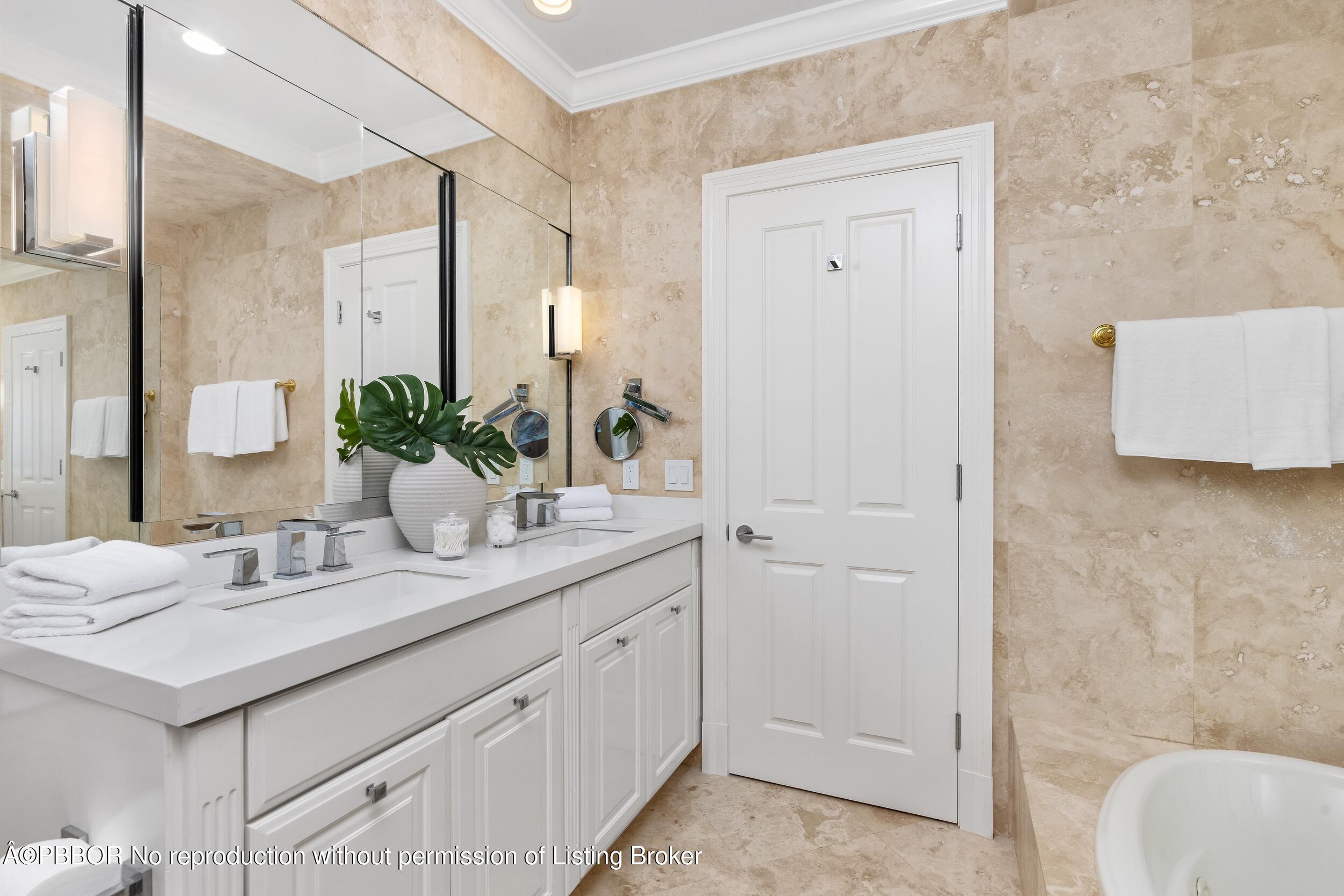 273 List Road Palm Beach, FL 33480 - Photo 17 of 54 a bathroom with a sink and a mirror