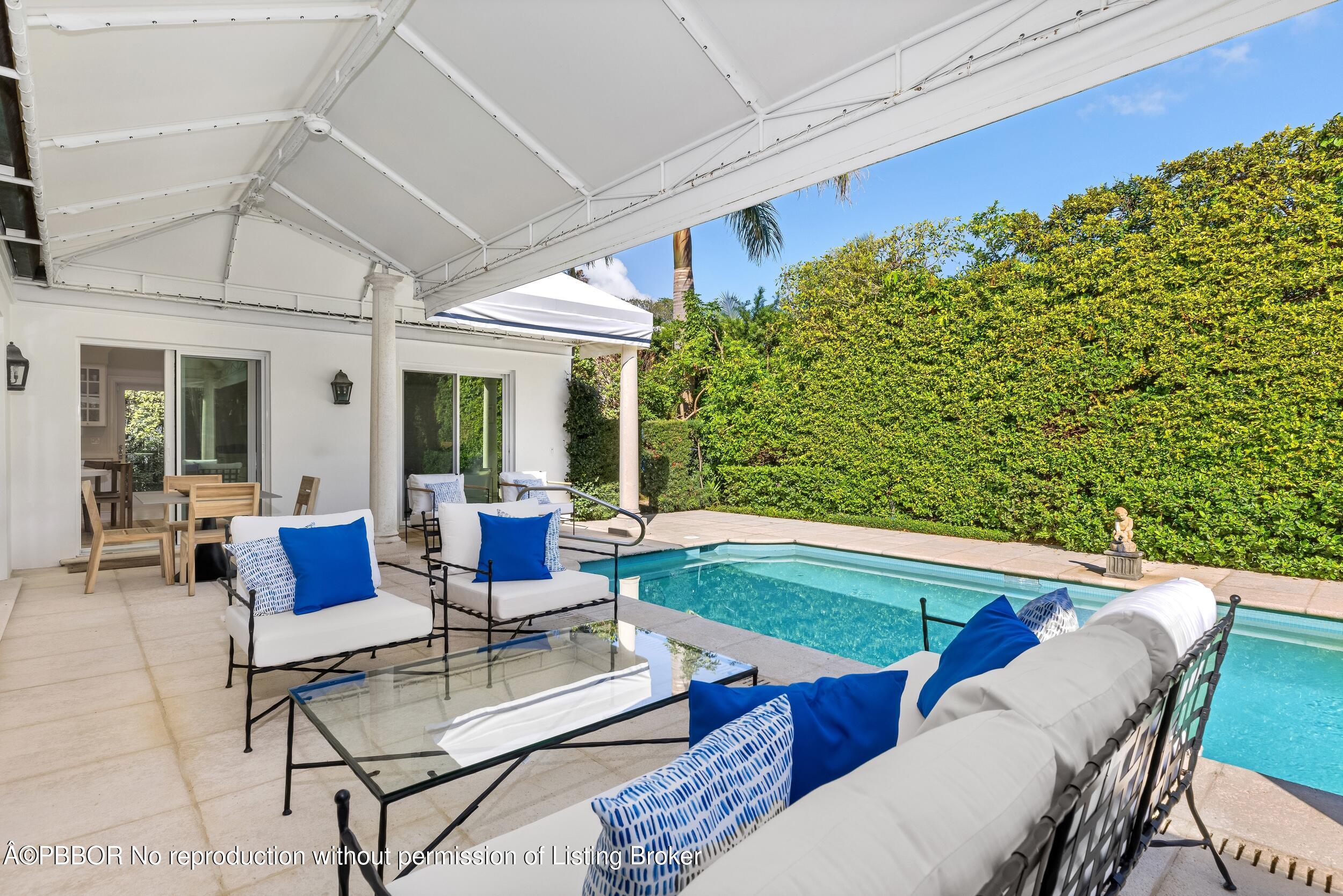 273 List Road Palm Beach, FL 33480 - Photo 26 of 54 a outdoor living space with furniture and garden view