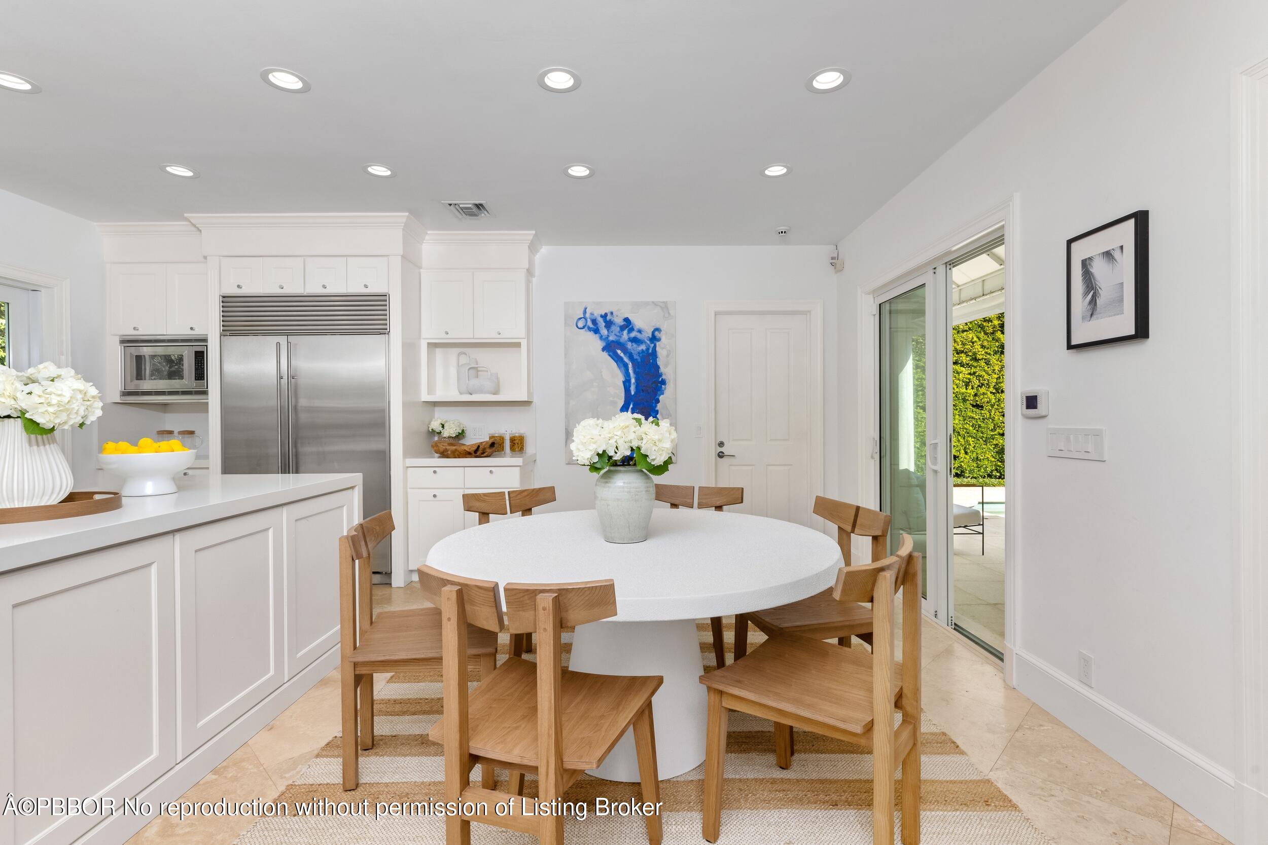 273 List Road Palm Beach, FL 33480 - Photo 29 of 54 a kitchen with a table and chairs in it