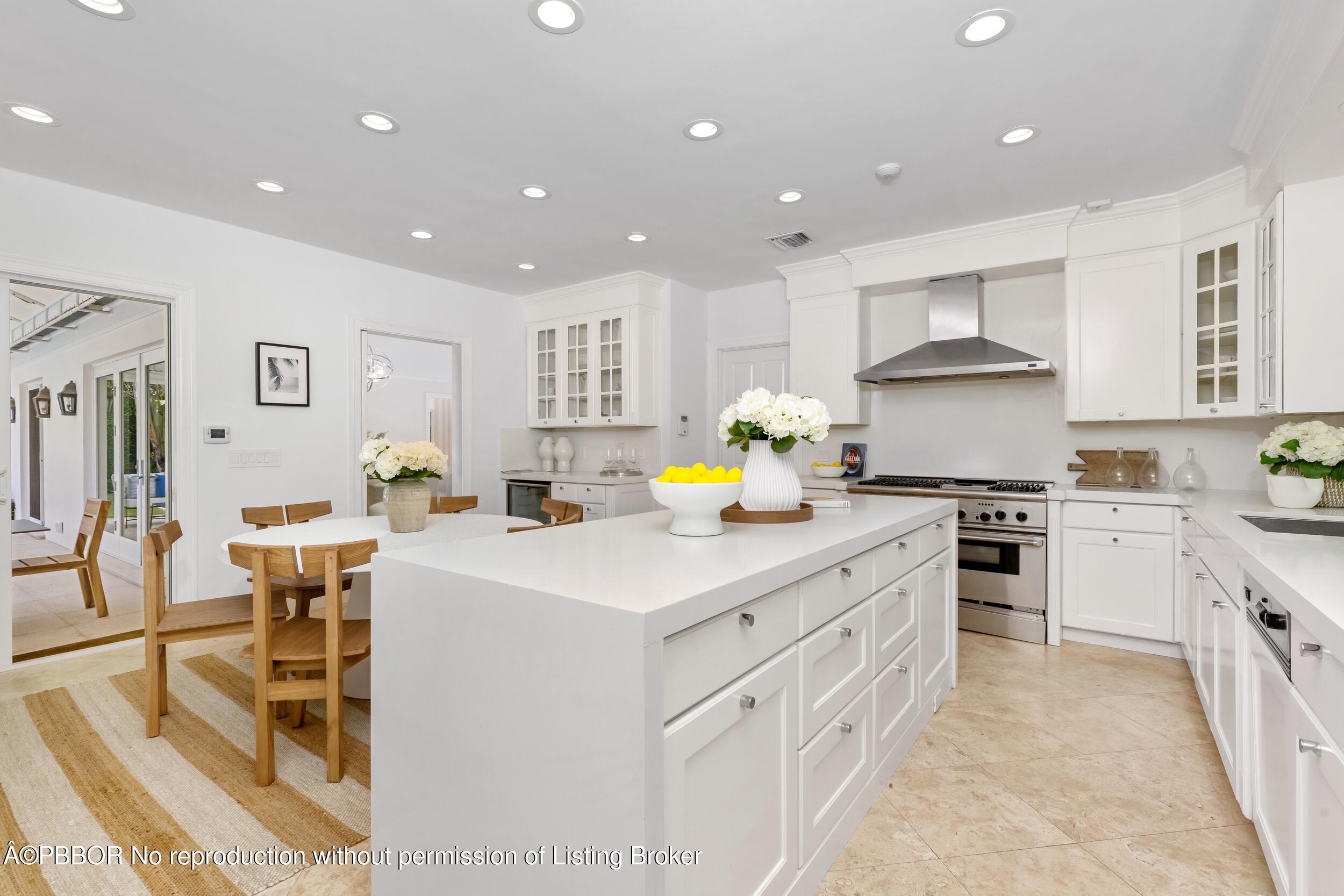 273 List Road Palm Beach, FL 33480 - Photo 34 of 54 a kitchen that has a lot of cabinets in it and appliances