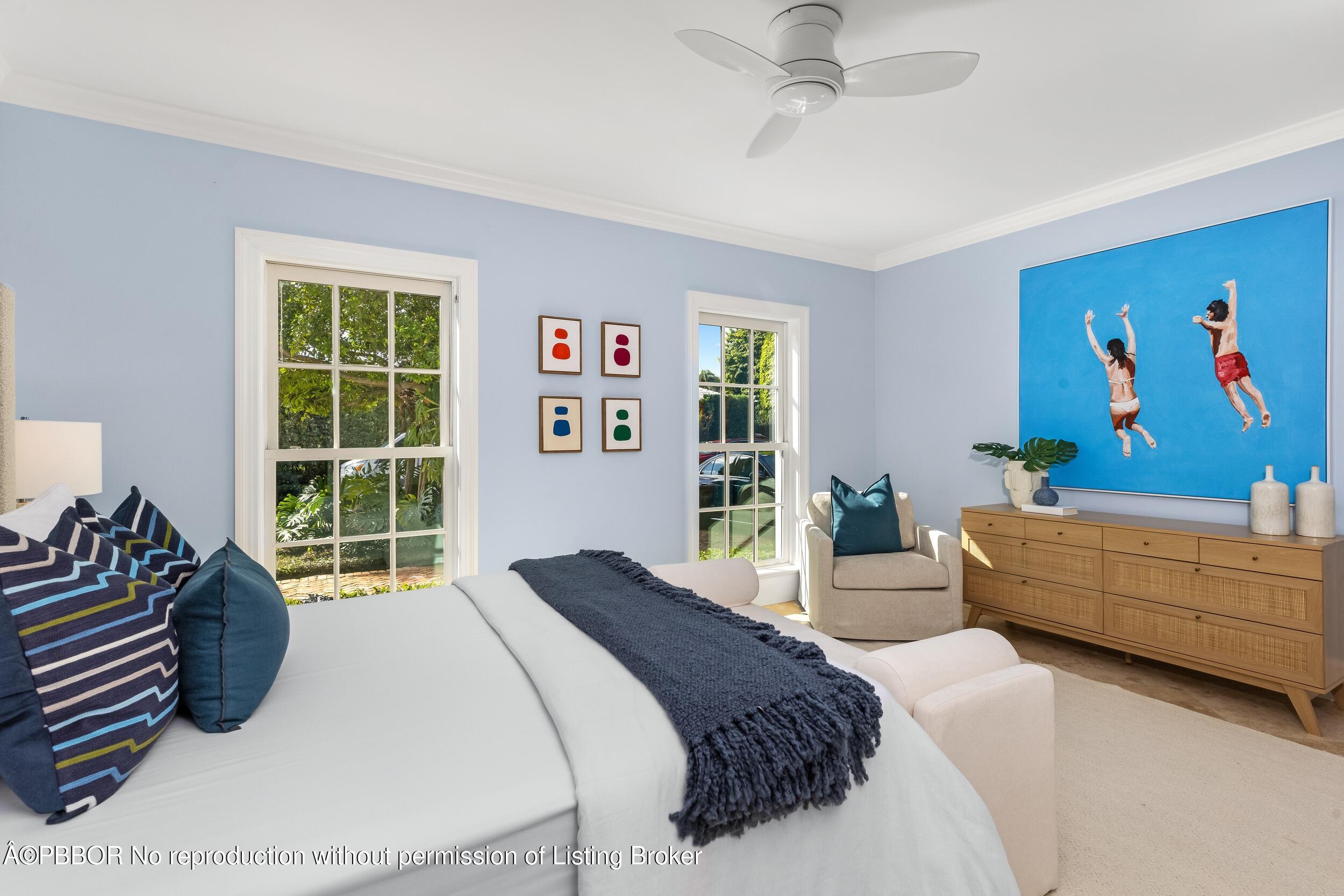 273 List Road Palm Beach, FL 33480 - Photo 36 of 54 a bedroom with a bed a couch and a window