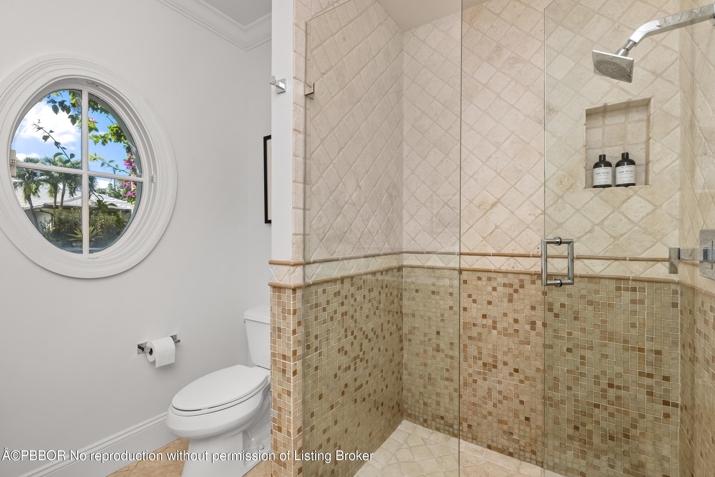 273 List Road Palm Beach, FL 33480 - Photo 38 of 54 a bathroom with a toilet and a shower curtain