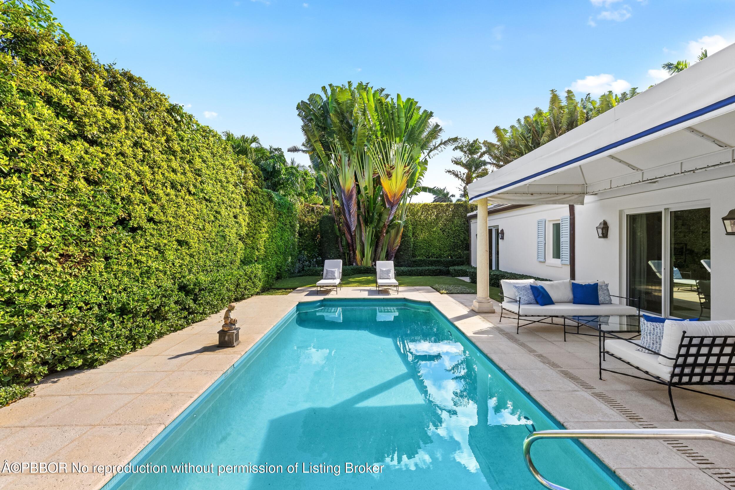 273 List Road Palm Beach, FL 33480 - Photo 41 of 54 a view of swimming pool with outdoor seating and plants