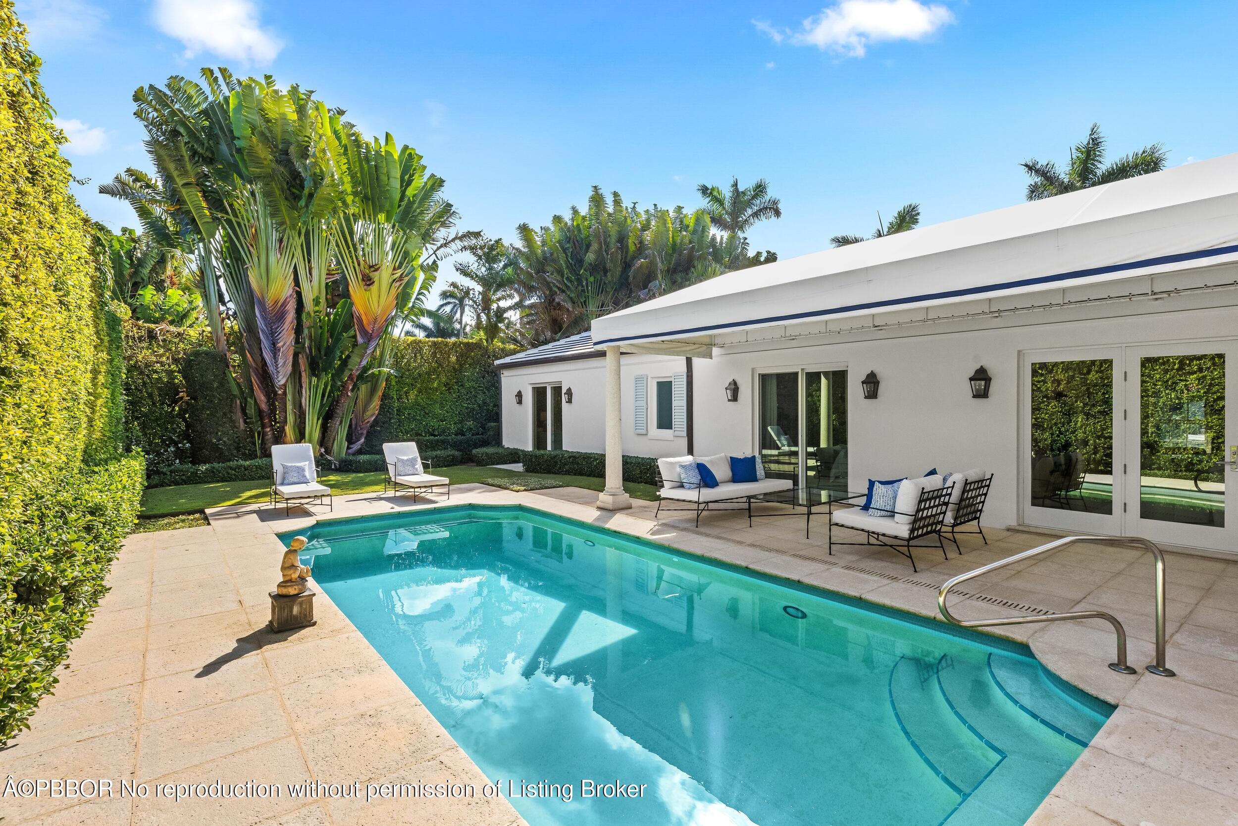 273 List Road Palm Beach, FL 33480 - Photo 42 of 54 a view of a house with backyard patio and swimming pool