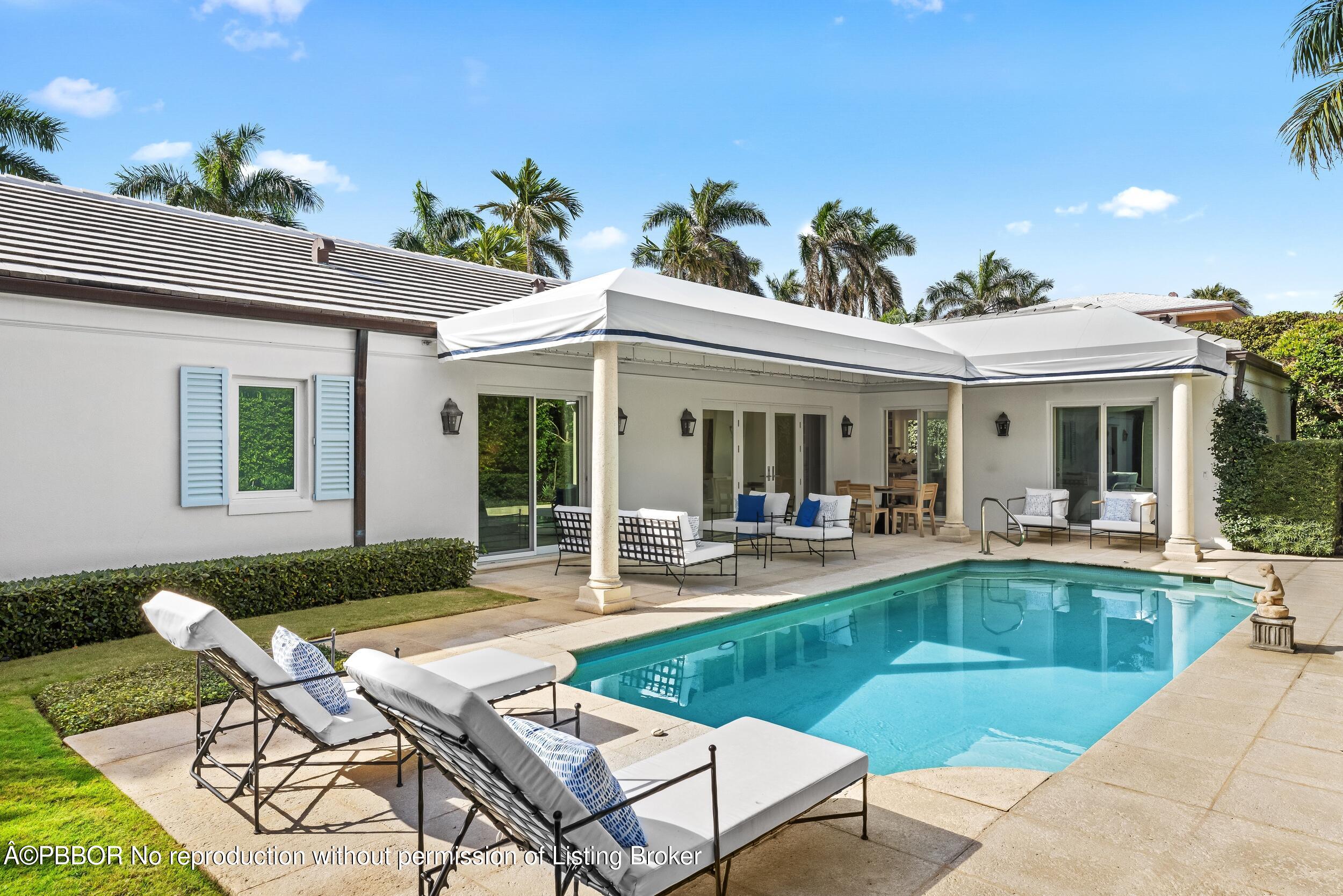 273 List Road Palm Beach, FL 33480 - Photo 44 of 54 a view of a house with swimming pool and sitting area