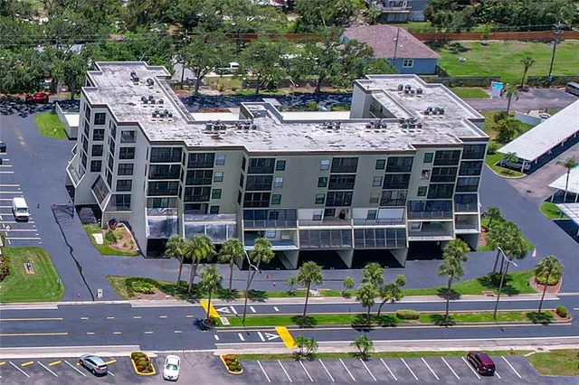 a view of multiple houses with a yard