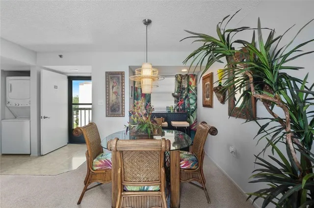 a view of a livingroom with furniture and a floor to ceiling window